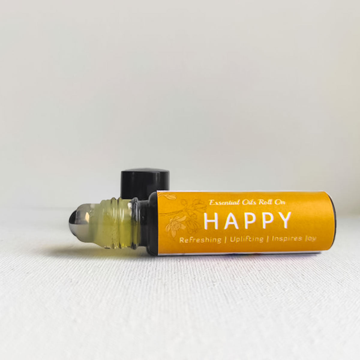 Uplifting, refreshing essential oil roll on happy